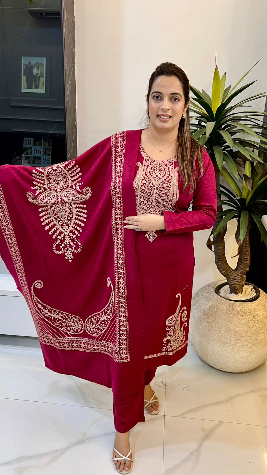 Premium woolen suit adorned with exquisite Zari work