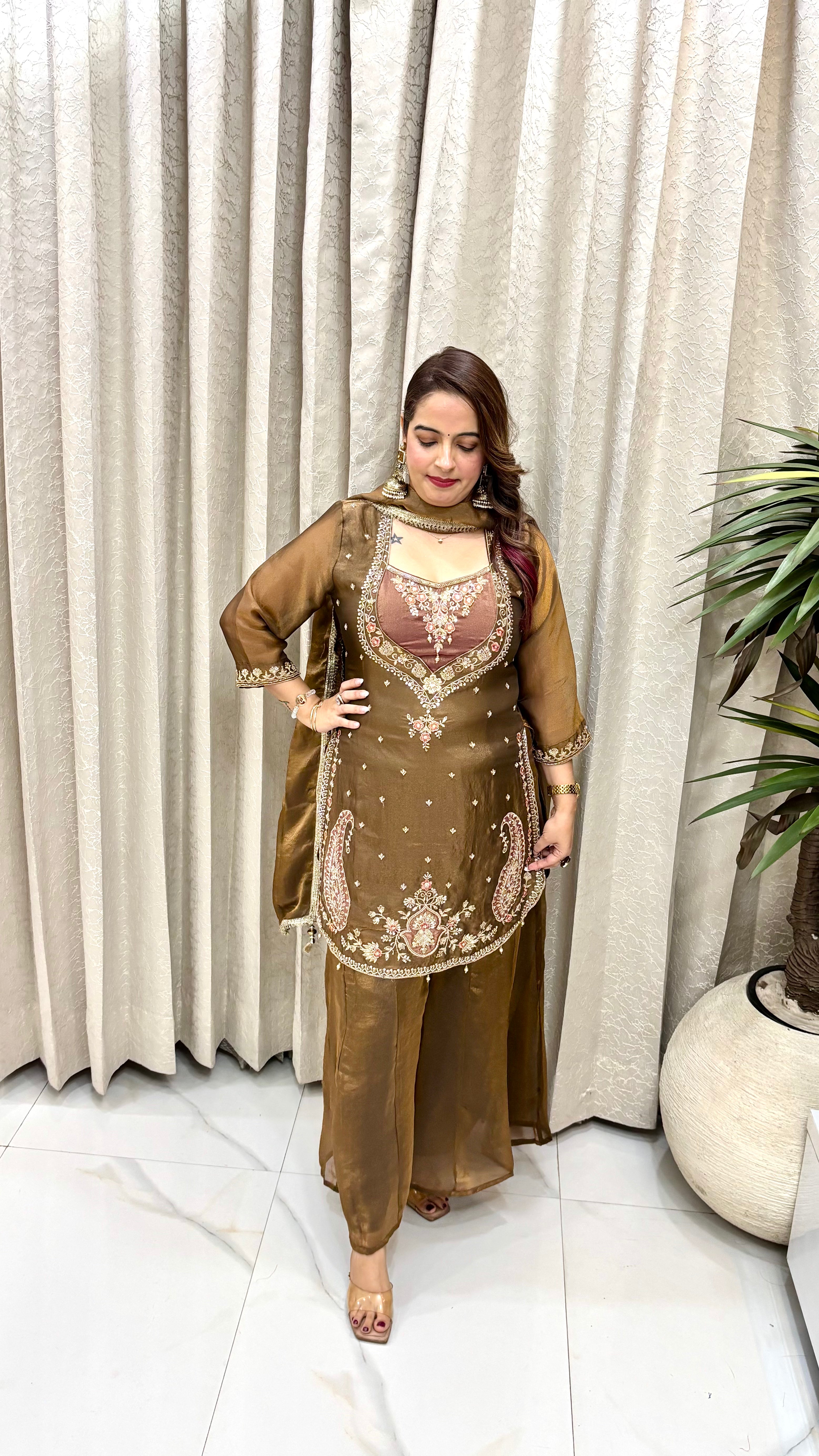 Luminous Royal Craftsmanship: Glossy Organza Shimmer, Regal Matka Neckline, Hand Embroidery, & 8-Kali Flared Divider