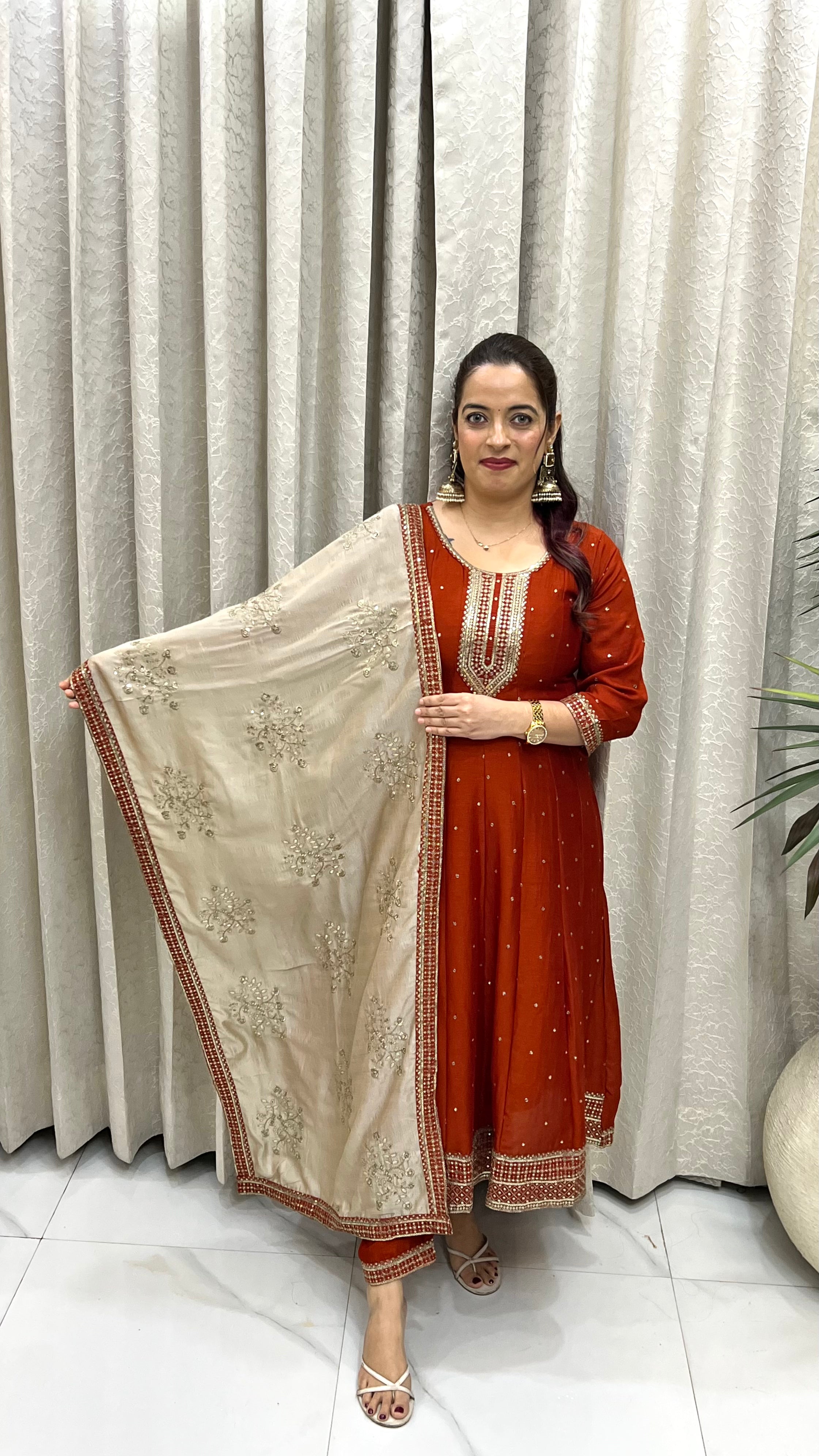 The Orange Pure Silk Anarkali Suit with Golden Paper Silk Dupatta