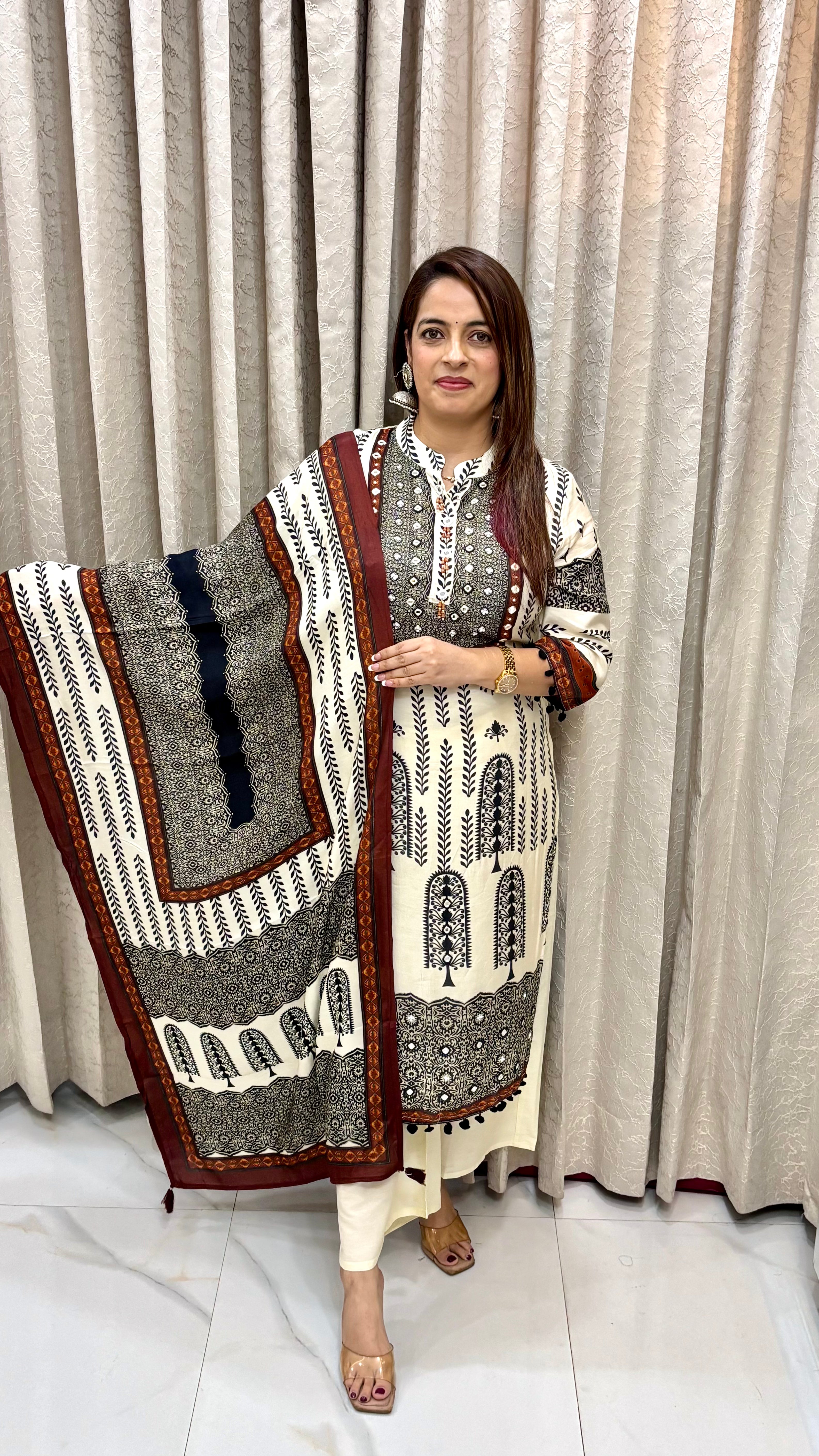 The Pure Crepe Ajrakh Print Suit with Hand Embroidery & Pom Pom Lace